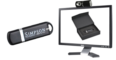 promotional usb stick next to flat screen TV with web cam