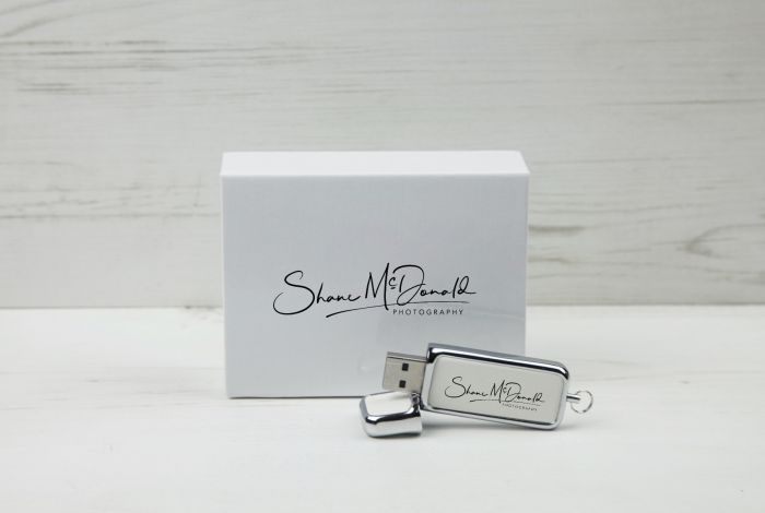 white leather USB with white box printed with photographer logo