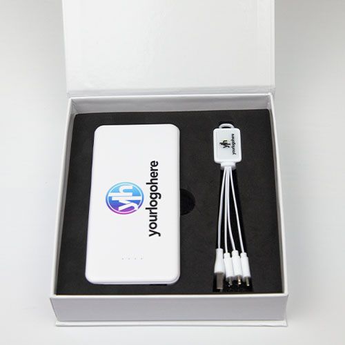 Corporate Gift Set featuring Promotional 3 in 1 Charging Cable and Pocket Pro 5000 Power Bank in white branded with 'your logo here'. presented in a white gloss gift box sitting in high density foam